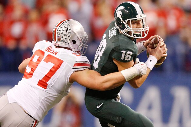 INDIANAPOLIS, IN - DECEMBER 07:  Joey Bosa #97 of the Ohio State Buckeyes sacks Connor Cook #18 of the Michigan State Spartans in the first quarter during the Big 10 Conference Championship Game at Lucas Oil Stadium on December 7, 2013 in Indianapolis, Indiana.  (Photo by Gregory Shamus/Getty Images)