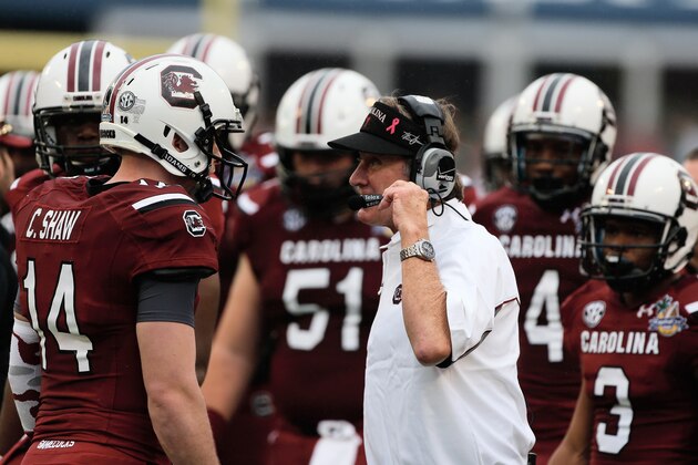 ORLANDO, FL - JANUARY 01:  Head coach Steve Spurrier of the South Carolina Gamecocks chats with his quarterback Connor Shaw #14 in the first half of their game against the Wisconsin Badgers at the Capital One Bowl on January 1, 2014 in Orlando, Florida.  (Photo by Scott Halleran/Getty Images)