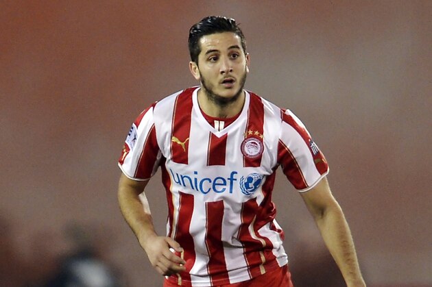 ATHENS,GREECE - JANUARY 12:  Kostas Manolas of Olympiacos during the Greek Superleague match between Atromitos Athinon and Olympiacos at the Peristeri Stadium on January 12, 2014 in Athens,Greece.  (Photo by Aris Messins/EuroFootball/Getty Images)