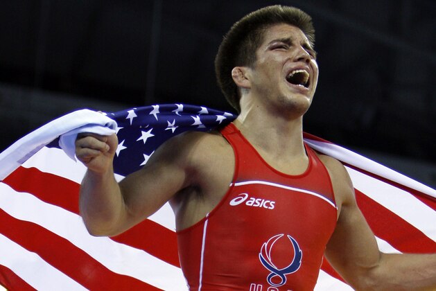 USA's Henry Cejudo celebrates his gold in 55 kilogram freestyle wrestling division after defeating Japan's Tomohiro Matsunaga in their gold medal match at the Beijing 2008 Olympics in Beijing, Tuesday, Aug. 19, 2008.  (AP Photo/Ed Wray)