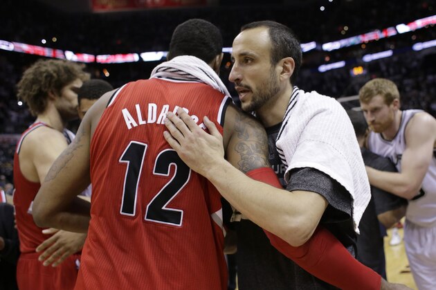 San Antonio Spurs' Manu Ginobili, right, of Argentina, hugs Portland Trail Blazers' LaMarcus Aldridge (12) following Game 5 of a Western Conference semifinal NBA basketball playoff series, Wednesday, May 14, 2014, in San Antonio. San Antonio won 104-82. (AP Photo/Eric Gay)