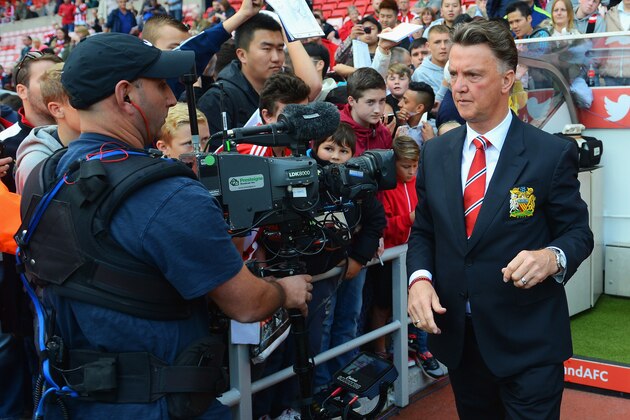 SUNDERLAND, ENGLAND - AUGUST 24:  Manager Louis van Gaal of Manchester United looks on as he is filmed by a TV cameraman prior to the Barclays Premier League match between Sunderland and Manchester United at Stadium of Light on August 24, 2014 in Sunderland, England.  (Photo by Michael Regan/Getty Images)