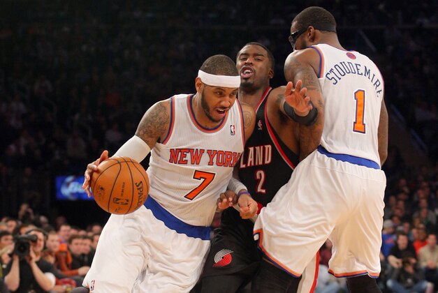 Feb 5, 2014; New York, NY, USA; New York Knicks small forward Carmelo Anthony (7) drives on Portland Trailblazers shooting guard Wesley Matthews (2) in front of New York Knicks power forward Amar'e Stoudemire (1) during the fourth quarter of a game at Madison Square Garden. The Trailblazers defeated the Knicks 94-90. Mandatory Credit: Brad Penner-USA TODAY Sports