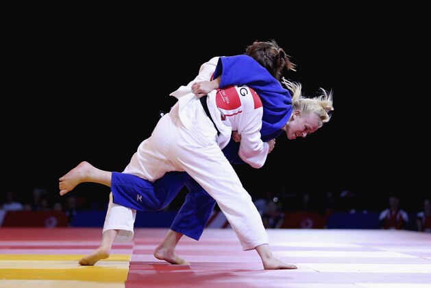 GLASGOW, SCOTLAND - JULY 25:  Faith Pitman (white) and Katharina Haecker of Australia (blue)  competes  in the Women's Judo 63 kg Bronze Medal Contest at SECC Precinct during day two of the Glasgow 2014 Commonwealth Games on July 25, 2014 in Glasgow, United Kingdom.  (Photo by Francois Nel/Getty Images)