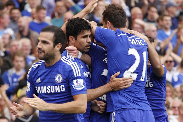 Chelsea's Diego Costa, second left, celebrates his goal against Leicester City with teammates during their English Premier League soccer match at Stamford Bridge, London, Saturday, Aug. 23, 2014. (AP Photo/Sang Tan)