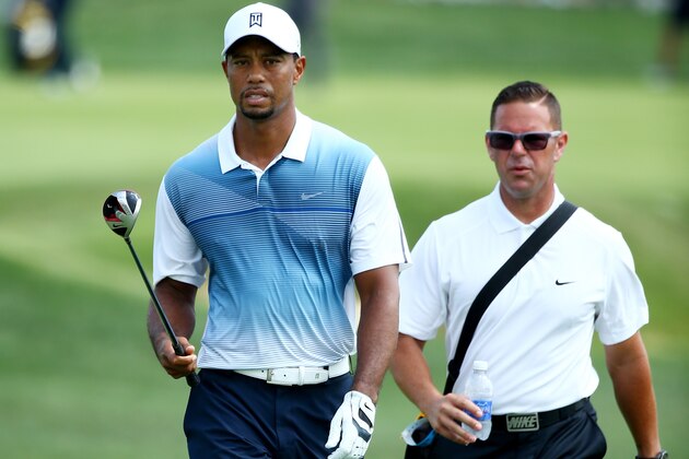 LOUISVILLE, KY - AUGUST 06:  Tiger Woods (L) of the United States walks with golf instructor Sean Foley (R) during a practice round prior to the start of the 96th PGA Championship at Valhalla Golf Club on August 6, 2014 in Louisville, Kentucky.  (Photo by Andy Lyons/Getty Images)