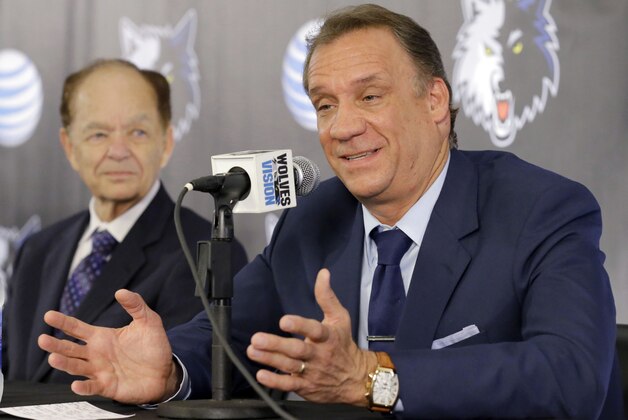 Minnesota Timberwolves team president of basketball operations and new head coach Flip Saunders, right, responds to a question as team owner Glen Taylor, left, listens during a media availability in Minneapolis, Friday, June 6, 2014.  (AP Photo/Ann Heisenfelt)