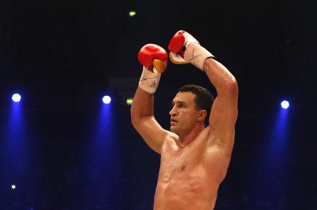 IBF, WBA, WBO and IBO champion Wladimir Klitschko from Ukraine celebrates knocking out his Australian challenger Alex Leapai during their heavyweight world title bout in Oberhausen, western Germany, Saturday, April 26, 2014. (AP Photo/Frank Augstein)