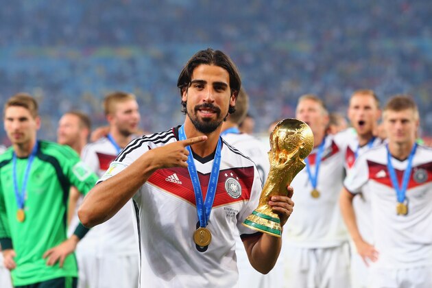 RIO DE JANEIRO, BRAZIL - JULY 13:  Sami Khedira of Germany celebrates with the World Cup trophy after defeating Argentina 1-0 in extra time during the 2014 FIFA World Cup Brazil Final match between Germany and Argentina at Maracana on July 13, 2014 in Rio de Janeiro, Brazil.  (Photo by Martin Rose/Getty Images)