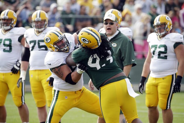 Green Bay Packers’ DJosh Boyd blocks Don Barclay during NFL football training camp Monday, July 28, 2014, in Green Bay, Wis. (AP Photo/Morry Gash)