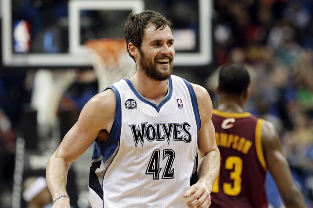 Minnesota Timberwolves' Kevin Love smiles after a three-point shot in the second half of an NBA basketball game against the Cleveland Cavaliers, Wednesday, Nov. 13, 2013, in Minneapolis. Love led the Timberwolves with 33 points in the team's 124-95 win. (AP Photo/Jim Mone)