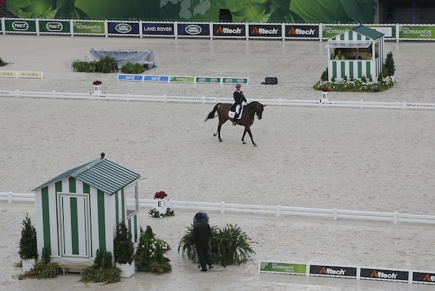 Carl Hester of Britain, riding Nip Tuck during the first day of Dressage team competition at the FEI World Equestrian Games, at Michel d'Ornano stadium in Cean, western France, Monday, Aug. 25, 2014. (AP Photo/Michel Euler)