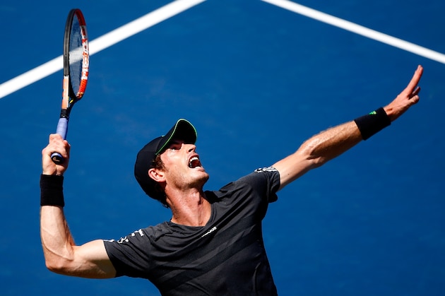 NEW YORK, NY - AUGUST 25:  Andy Murray of Great Britain serves a shot against Robin Haase of the Netherlands during his men's singles first round match on Day One of the 2014 US Open at the USTA Billie Jean King National Tennis Center on August 25, 2014  in the Flushing neighborhood of the Queens borough of New York City.  (Photo by Julian Finney/Getty Images)
