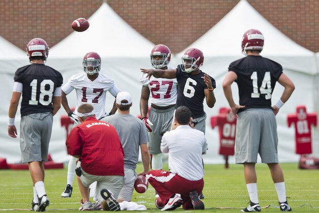 Alabama Crimson Tide quarterback Blake Sims (6) throws the ball among his teammates during an NCAA college football practice, at the Thomas-Drew practice fields on Friday, Aug. 1, 2014, in Tuscaloosa, Ala. (AP Photo/Brynn Anderson)