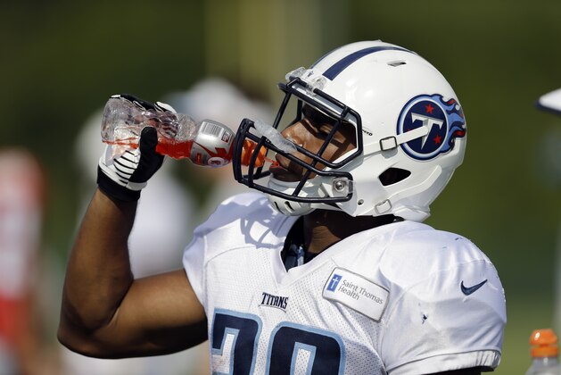 Tennessee Titans running back Bishop Sankey takes a break during NFL football training camp Wednesday, Aug. 13, 2014, in Nashville, Tenn. (AP Photo/Mark Humphrey)