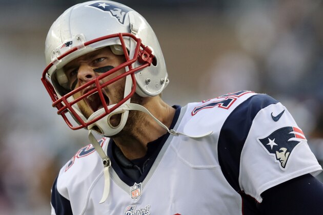 New England Patriots quarterback Tom Brady runs onto the field before an NFL preseason football game against the Carolina Panthers Friday, Aug. 22, 2014, in Foxborough, Mass. (AP Photo/Charles Krupa)