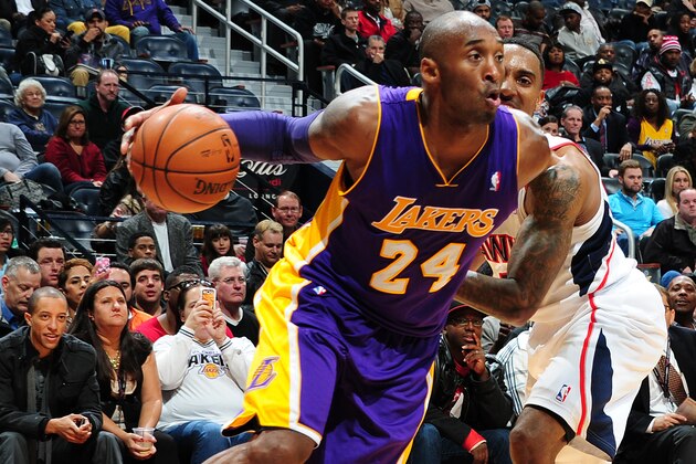 ATLANTA, GA - DECEMBER 16: Kobe Bryant #24 of the Los Angeles Lakers drives to the basket against the Atlanta Hawks on December 16, 2013 at Philips Arena in Atlanta, Georgia.  NOTE TO USER: User expressly acknowledges and agrees that, by downloading and/or using this Photograph, user is consenting to the terms and conditions of the Getty Images License Agreement. Mandatory Copyright Notice: Copyright 2013 NBAE (Photo by Scott Cunningham/NBAE via Getty Images)