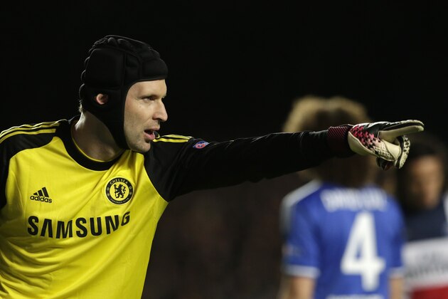 Chelsea goalkeeper Petr Cech pouts to his teammates during the Champions League quarterfinal second leg soccer match between Chelsea and Paris Saint Germain at Stamford Bridge stadium in London, Tuesday, April 8, 2014. (AP Photo/Matt Dunham).