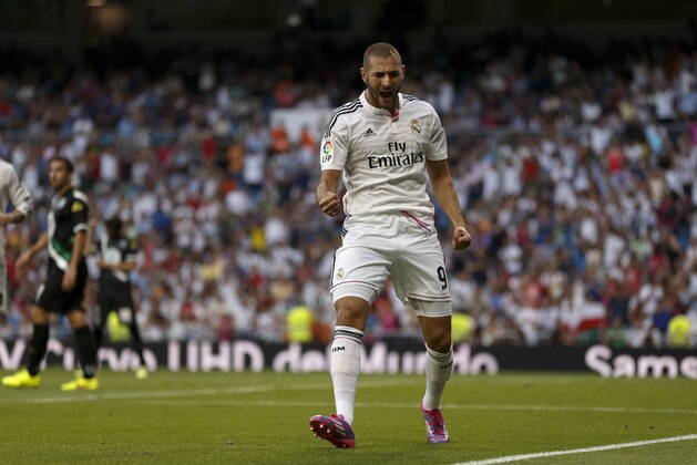 Real Madrid's Karim Benzema from France, celebrates his goal during a Spanish La Liga soccer match between Real Madrid and Cordoba at the Santiago Bernabeu stadium in Madrid, Spain, Monday, Aug. 25, 2014 . (AP Photo/Daniel Ochoa de Olza)