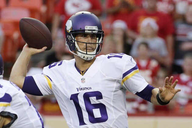 Minnesota Vikings quarterback Matt Cassel throws a pass against the Kansas City Chiefs during the first half of an NFL preseason football game in Kansas City, Mo., Saturday, Aug. 23, 2014. (AP Photo/Charlie Riedel)