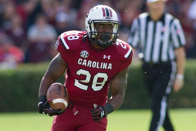 Nov 2, 2013; Columbia, SC, USA; South Carolina Gamecocks running back Mike Davis (28) runs the ball during the first quarter against the Mississippi State Bulldogs at Williams-Brice Stadium. Mandatory Credit: Jeremy Brevard-USA TODAY Sports