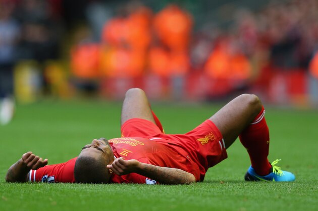 LIVERPOOL, ENGLAND - SEPTEMBER 01:  Glen Johnson of Liverpool lies injured during the Barclays Premier League match between Liverpool and Manchester United at Anfield on September 01, 2013 in Liverpool, England.  (Photo by Alex Livesey/Getty Images)
