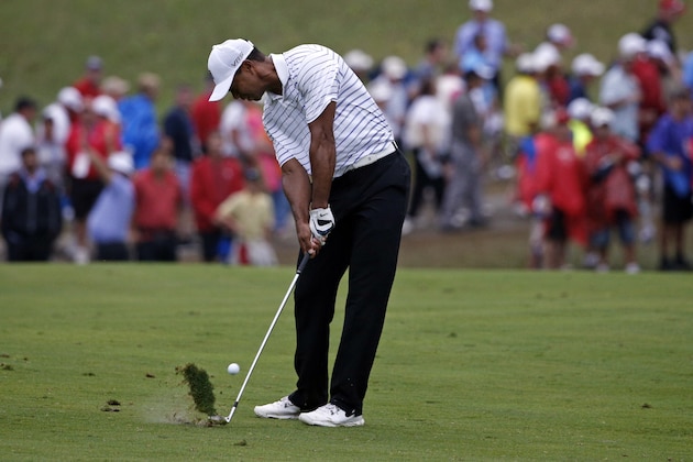 Tiger Woods hits from the fairway on the 17th hole during the second round of the PGA Championship golf tournament at Valhalla Golf Club on Friday, Aug. 8, 2014, in Louisville, Ky. (AP Photo/Mike Groll)