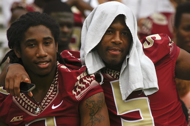 Florida State defensive back Ronald Darby (3) and quarterback Jameis Winston (5) pose for cameras during their NCAA college football media day on Sunday, Aug. 10, 2014, in Tallahassee, Fla. (AP Photo/Phil Sears)