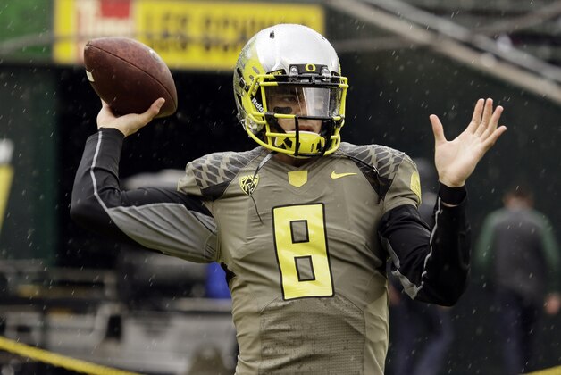 Oregon quarterback Marcus Mariota is shown before an NCAA college football game against Utah in Eugene, Ore., Saturday, Nov. 16, 2013. (AP Photo/Don Ryan)