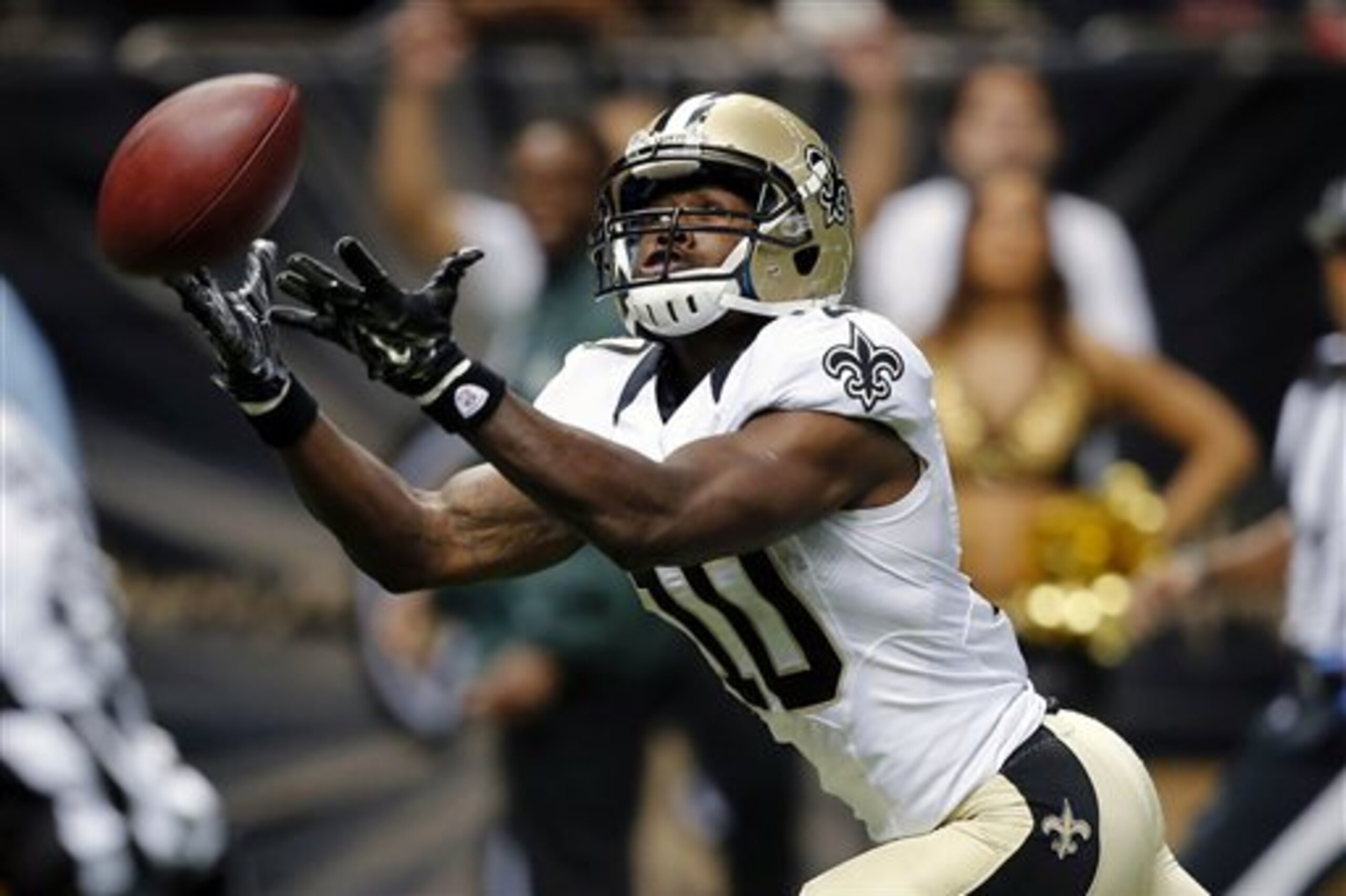 New Orleans Saints wide receiver Brandin Cooks (10) tries in vain to pull in a long pass in the second half of a NFL preseason football game against the Tennessee Titans in New Orleans, Friday, Aug. 15, 2014. (AP Photo/Bill Haber)