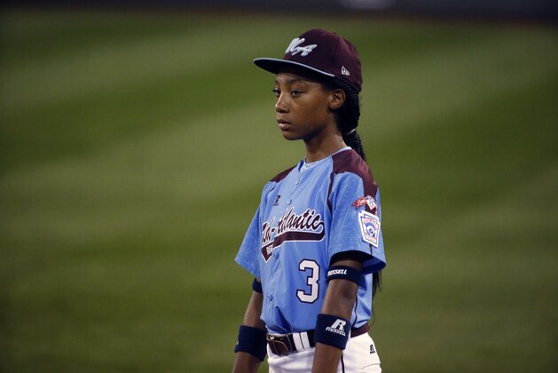 Philadelphia's  Mo'ne Davis (3) pauses during a play review during the second inning of an elimination baseball game against Chicago at the Little League World Series tournament in South Williamsport, Pa., Thursday, Aug. 21, 2014. Chicago won 6-5.  (AP Photo/Gene J. Puskar)