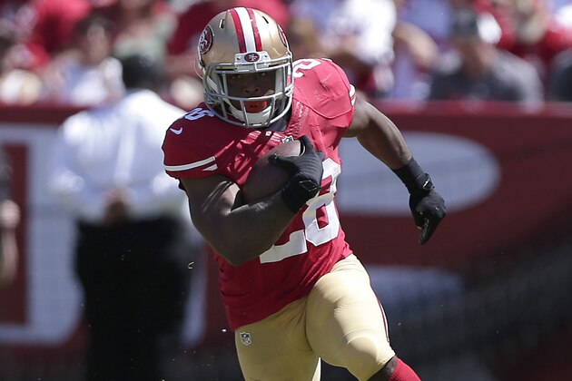 San Francisco 49ers running back Carlos Hyde (28) runs against the San Diego Chargers during an NFL preseason football game in Santa Clara, Calif., Sunday, Aug. 24, 2014. (AP Photo/Marcio Jose Sanchez)