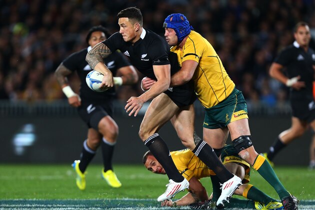 AUCKLAND, NEW ZEALAND - AUGUST 25: Sonny Bill Williams of the All Blacks looks to offload the ball in the tackle of Nathan Sharpe of the Wallabies during The Rugby Championship Bledisloe Cup match between the New Zealand All Blacks and the Australian Wallabies at Eden Park on August 25, 2012 in Auckland, New Zealand.  (Photo by Simon Watts/Getty Images)