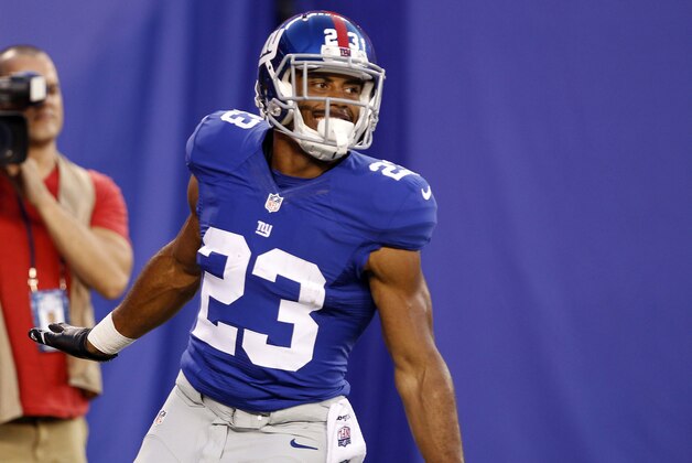 Aug 9, 2014; East Rutherford, USA; New York Giants running back Rashad Jennings (23) celebrates after scoring a touchdown against the Pittsburgh Steelers during the preseason game at MetLife Stadium. Mandatory Credit: William Perlman/THE STAR-LEDGER via USA TODAY Sports