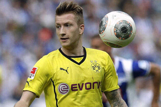 Dortmund's Marco Reus plays the ball during the German Bundesliga soccer match between Hertha BSC Berlin and Borussia Dortmund in Berlin, Germany, Saturday, May 10, 2014. Dortmund defeated Hertha by 4-0. (AP Photo/Michael Sohn)