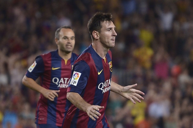 FC Barcelona's Lionel Messi, from Argentina, reacts after scoring against Elche during a Spanish La Liga soccer match at the Camp Nou stadium in Barcelona, Spain, Sunday, Aug. 24, 2014. (AP Photo/Manu Fernandez)