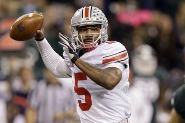 FILE - In this Dec. 7, 2013, file photo, Ohio State quarterback Braxton Miller throws a pass against Michigan State during the Big Ten Conference championship NCAA college football game in Indianapolis. Despite missing nearly three full games with a sprained knee last season, he passed for 2,094 yards and 24 touchdowns, and ran for 1,068 yards and 12 scores.  (AP Photo/Michael Conroy, File)