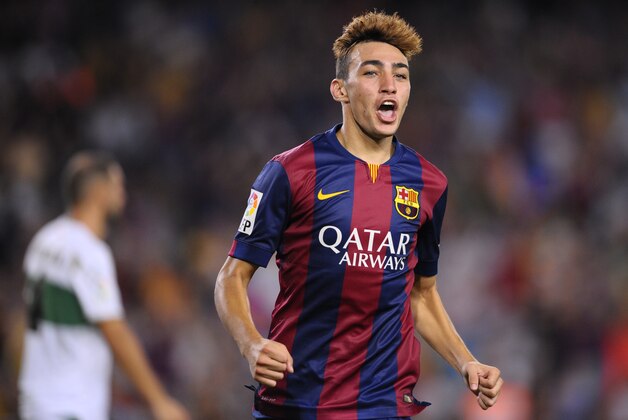 FC Barcelona's Munir reacts after scoring against Elche during a Spanish La Liga soccer match at the Camp Nou stadium in Barcelona, Spain, Sunday, Aug. 24, 2014. (AP Photo/Manu Fernandez)