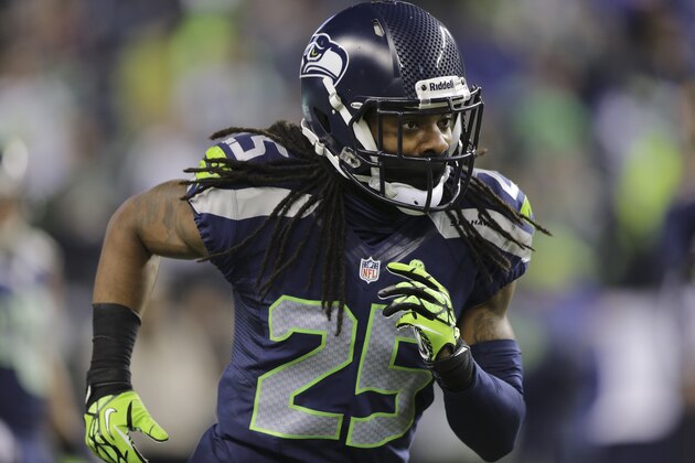 Seattle Seahawks' cornerback Richard Sherman runs on the field before an NFL football game against the New Orleans Saints, Monday, Dec. 2, 2013, in Seattle. (AP Photo/Scott Eklund)