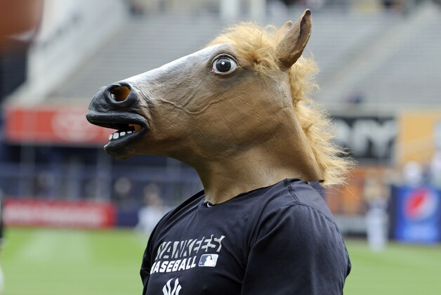 New York Yankees pitcher Shawn Kelley came out to stretch with a horse head mask on before a baseball game against the Chicago White Sox Saturday, Aug. 23, 2014, at Yankee Stadium in New York. (AP Photo/Bill Kostroun) New York Yankees pitcher Shawn Kelley came out to stretch with a horse head mask on before a baseball game against the Chicago White Sox Saturday, Aug. 23, 2014, at Yankee Stadium in New York. (AP Photo/Bill Kostroun)