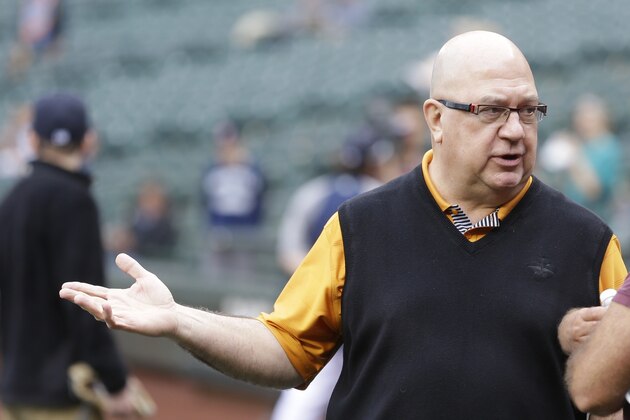 Seattle Mariners general manager Jack Zduriencik visits on the field prior to a baseball game between the Seattle Mariners and the New York Mets, Tuesday, July 22, 2014 in Seattle. (AP Photo)