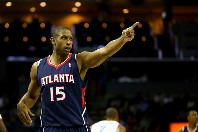 CHARLOTTE, NC - NOVEMBER 11:  Al Horford #15 of the Atlanta Hawks points to a teammate during their game against the Charlotte Bobcats at Time Warner Cable Arena on November 11, 2013 in Charlotte, North Carolina.  NOTE TO USER: User expressly acknowledges and agrees that, by downloading and or using this photograph, User is consenting to the terms and conditions of the Getty Images License Agreement.  (Photo by Streeter Lecka/Getty Images)