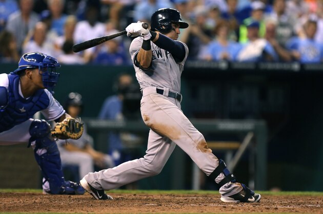 KANSAS CITY, MO - AUGUST 25:  Jacoby Ellsbury #22 of the New York Yankees hits a RBI single in the seventh inning against the Kansas City Royals at Kauffman Stadium on August 25, 2014 in Kansas City, Missouri. (Photo by Ed Zurga/Getty Images)