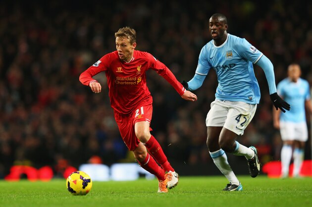 MANCHESTER, ENGLAND - DECEMBER 26: Lucas of Liverpool is closed down by Yaya Toure of Manchester City during the Barclays Premier League match between Manchester City and Liverpool at Etihad Stadium on December 26, 2013 in Manchester, England.  (Photo by Alex Livesey/Getty Images)