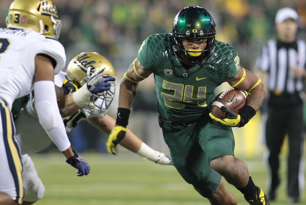 Oct 26, 2013; Eugene, OR, USA; Oregon Ducks running back Thomas Tyner (24) runs the ball against the UCLA Bruins at Autzen Stadium. Mandatory Credit: Scott Olmos-USA TODAY Sports