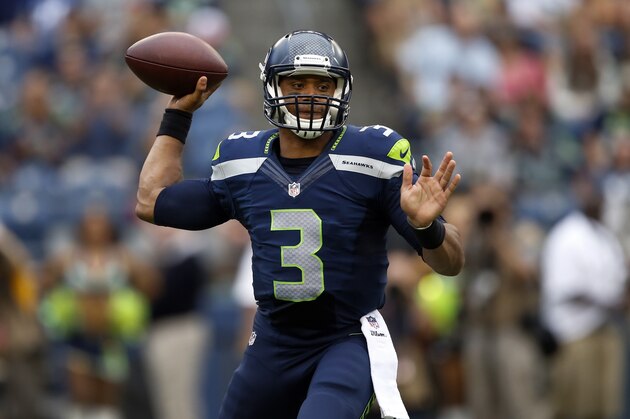 SEATTLE, WA - AUGUST 15: Quarterback Russell Wilson #3 of the Seattle Seahawks  passes the ball during the first quarter of the game against the San Diego Chargers at CenturyLink Field on August 15, 2014 in Seattle,Wa. (Photo by Otto Gruele/Getty Images)