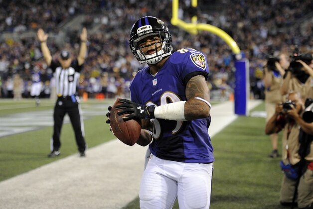 Baltimore Ravens wide receiver Steve Smith prepares to throw the ball into the stands after scoring a touchdown in the first half of an NFL preseason football game against the Washington Redskins, Saturday, Aug. 23, 2014, in Baltimore. (AP Photo/Nick Wass)