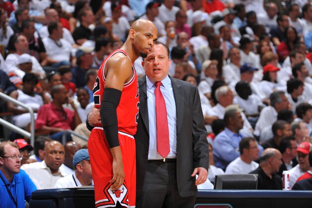 ATLANTA ,GA - MAY 12:  Chicago Bulls head coach Tom Thibodeau speaks to Taj Gibson #22 during a break in the action against the Atlanta Hawks during Game Six of the Eastern Conference Semifinals in the 2011 NBA Playoffs on May 12, 2011 at Phillips Arena in Atlanta, Georgia.  NOTE TO USER: User expressly acknowledges and agrees that, by downloading and/or using this Photograph, user is consenting to the terms and conditions of the Getty Images License Agreement. Mandatory Copyright Notice: Copyright 2011 NBAE   (Photo by Jesse D. Garrabrant/NBAE via Getty Images)