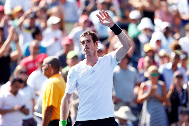 NEW YORK, NY - AUGUST 25:  Andy Murray of Great Britain signs waves to fans after defeating Robin Haase of the Netherlands during his men's singles first round match on Day One of the 2014 US Open at the USTA Billie Jean King National Tennis Center on August 25, 2014  in the Flushing neighborhood of the Queens borough of New York City.  (Photo by Julian Finney/Getty Images)