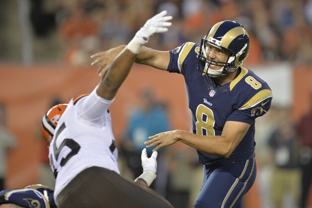 St. Louis Rams quarterback Sam Bradford is hit by Cleveland Browns defensive end Armonty Bryant (95) in the first quarter of a preseason NFL football game Saturday, Aug. 23, 2014, in Cleveland. Bradford left the game and was taken to the locker room after the play. St. Louis won 33-14. (AP Photo/David Richard)